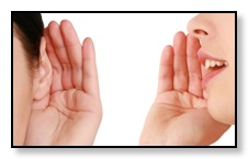 Woman hold her ear to show she is listening